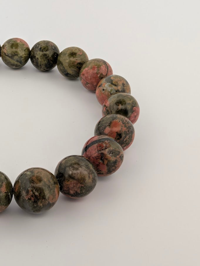 Close-up of polished 8MM Unakite beads