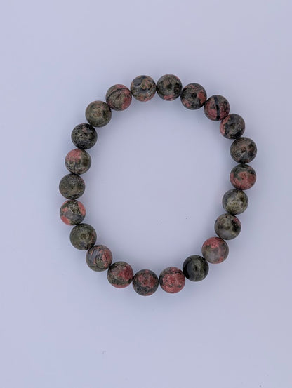 Top view of polished 8MM Unakite bracelet