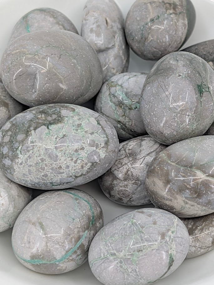 Close-up of Variscite stones showing natural mint tones and subtle matrix patterns