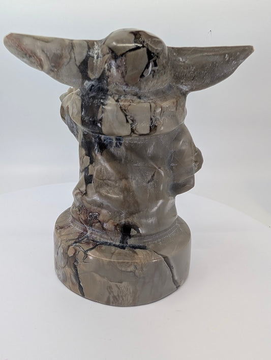 Left angle view showing robe folds and brecciated pattern in volcano agate Gorgu carving