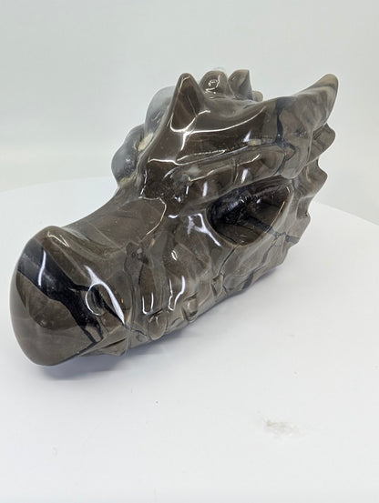 Side view of Volcano Agate Dragon Head Variant A showing dark and light banding
