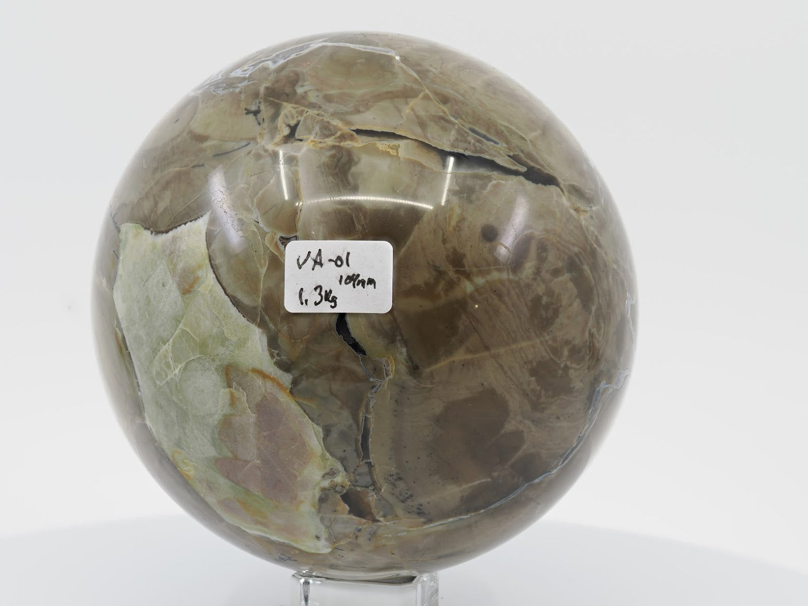 1.3kg Volcano Agate sphere with a distinct light green brecciated mineral inclusion and highly polished surface.