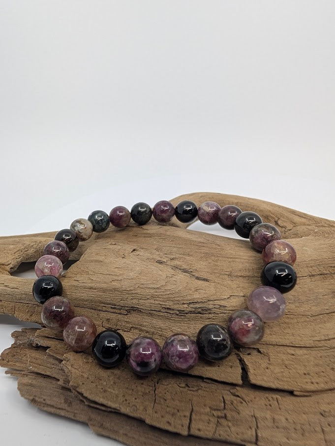 8MM Watermelon Tourmaline bracelet displayed on wood