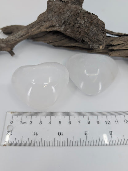 Size measurement of White Calcite hearts approx 6-6.5cm wide.