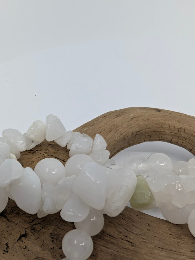Close-up of polished 6MM White Jade bracelet beads