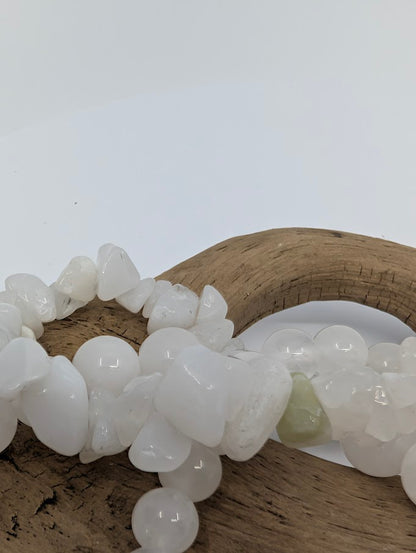 Close-up of polished 6MM White Jade bracelet beads
