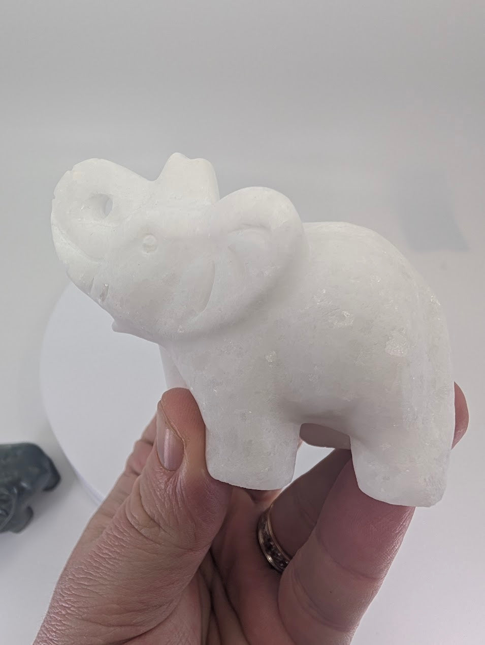White Jade elephant carving, 215 g, in-hand view