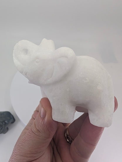 White Jade elephant carving, 215 g, in-hand view