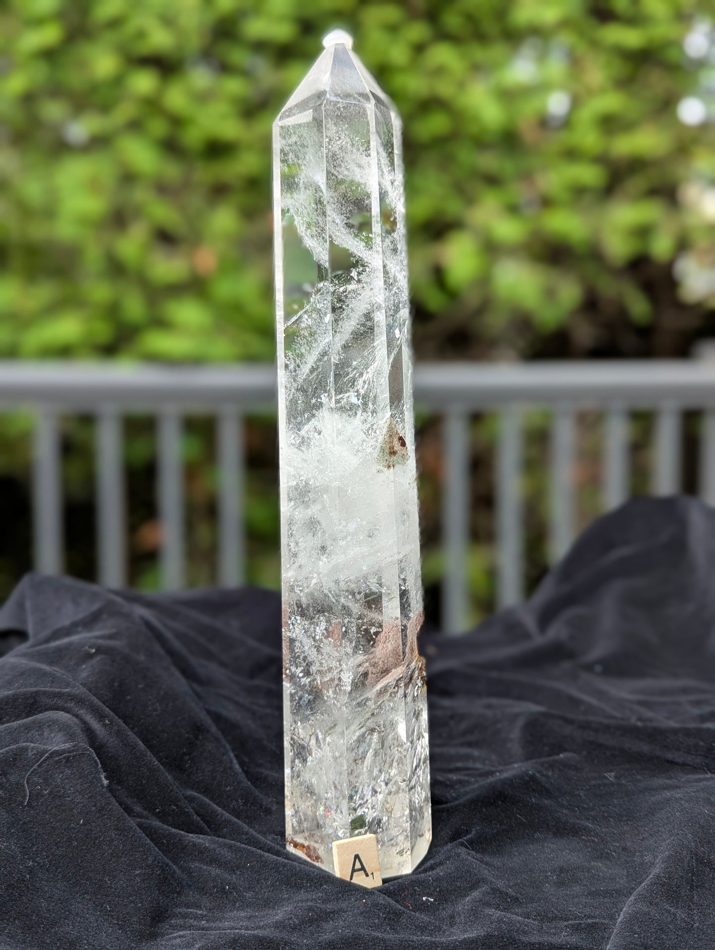 Garden Quartz Tower A showing dramatic red-brown and golden landscape inclusion inside polished clear quartz
