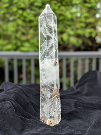 Garden Quartz Tower A showing dramatic red-brown and golden landscape inclusion inside polished clear quartz