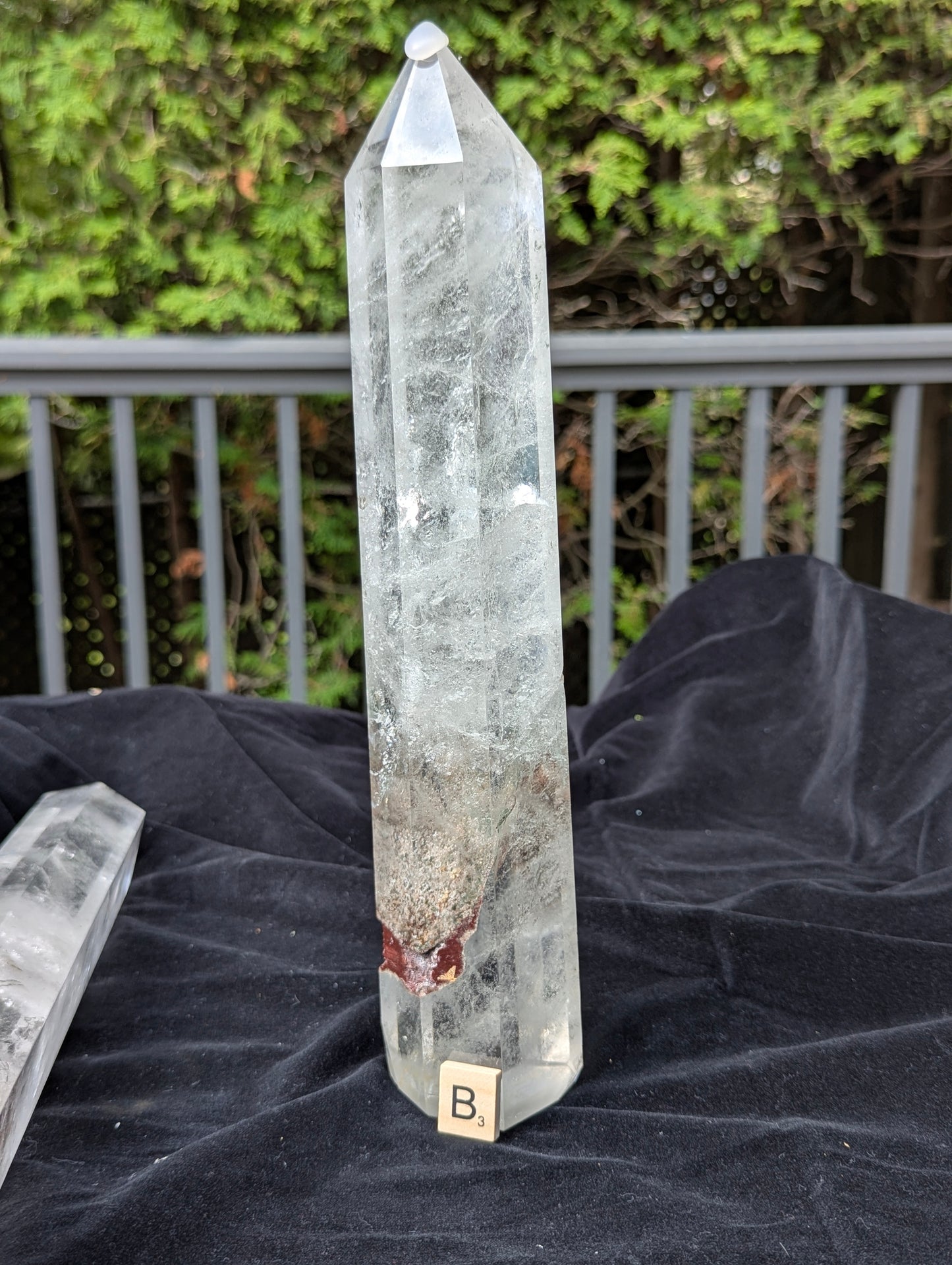 Tower B polished Garden Quartz point showing large earthy garden inclusion near the lower body