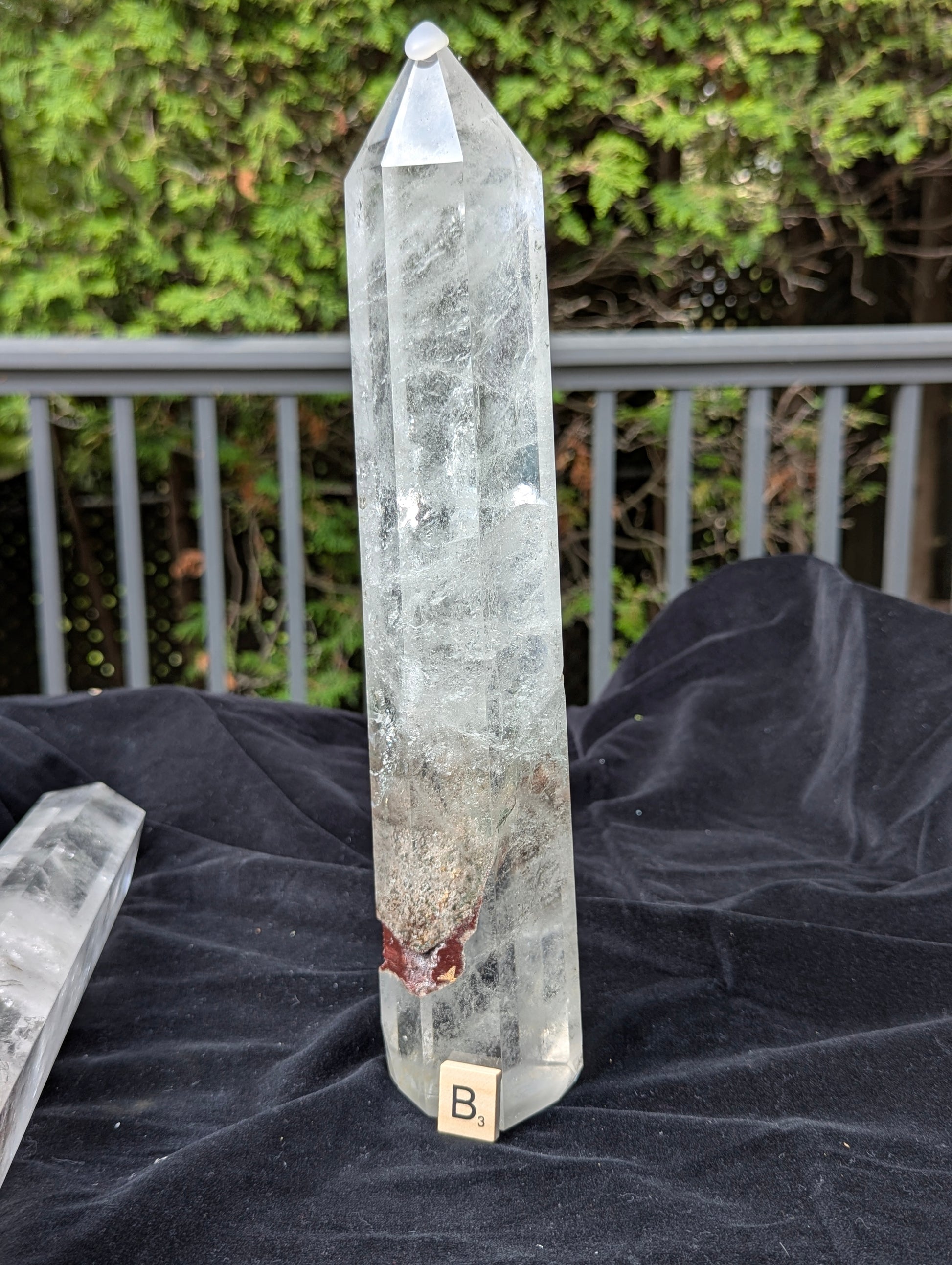 Tower B polished Garden Quartz point showing large earthy garden inclusion near the lower body