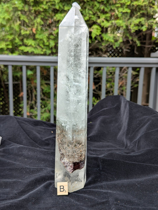 XL Garden Quartz Tower B standing upright with misty internal veils and earthy lower mineral inclusions