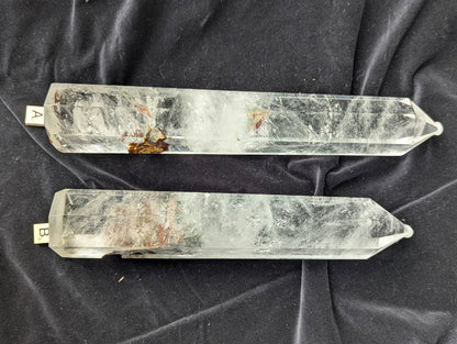 Garden Quartz Towers A and B comparison showing red-brown earthy inclusions and clear quartz veiling