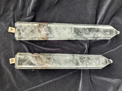 Large polished Garden Quartz Towers A and B displayed side by side with icy internal veils and scenic inclusions