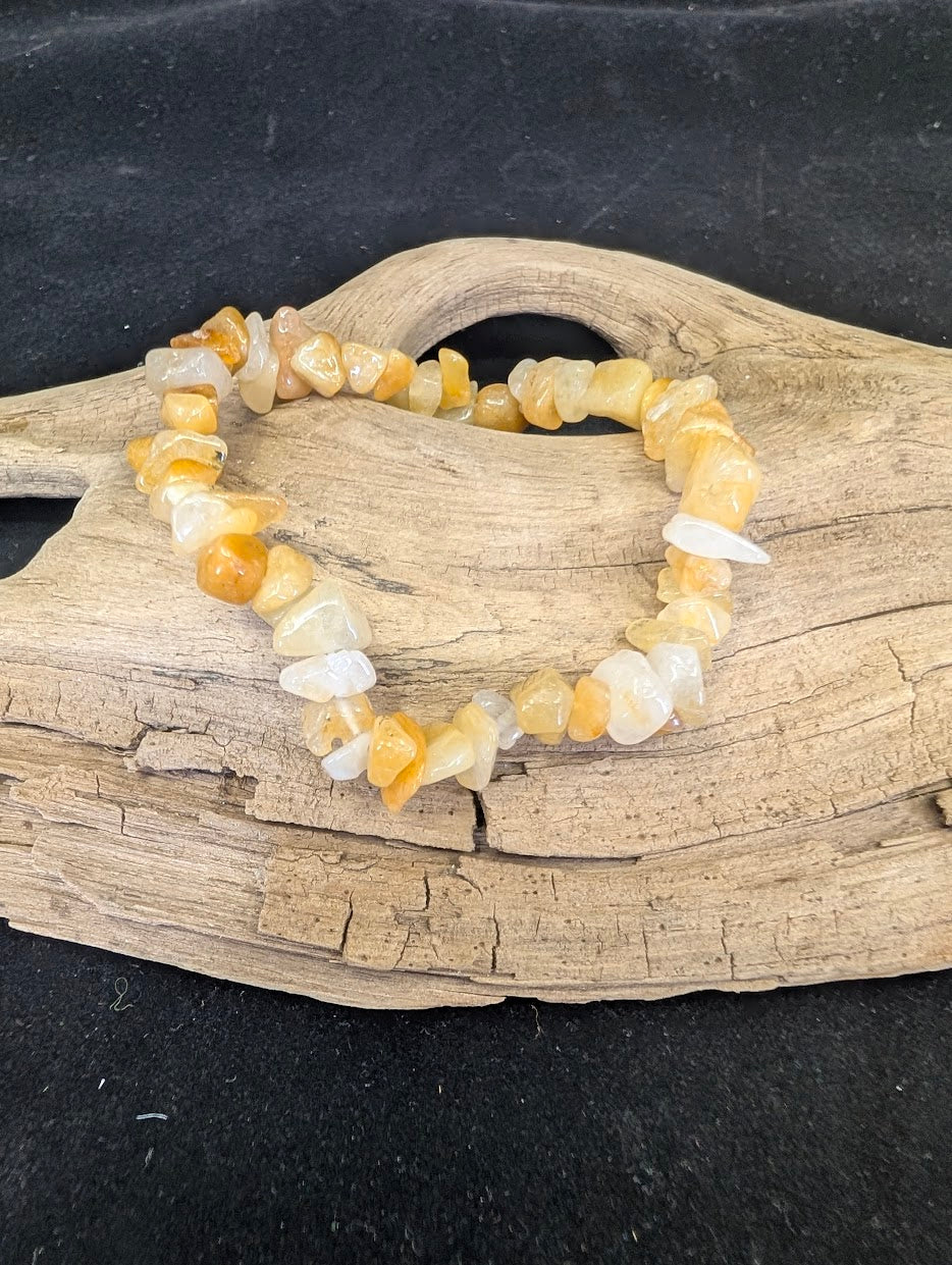 Full view of a Yellow Aventurine chip bracelet featuring polished golden quartz shards on a driftwood display.