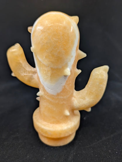 Front view of Yellow Calcite cactus crystal carving, 6 x 4.5 in, 825g