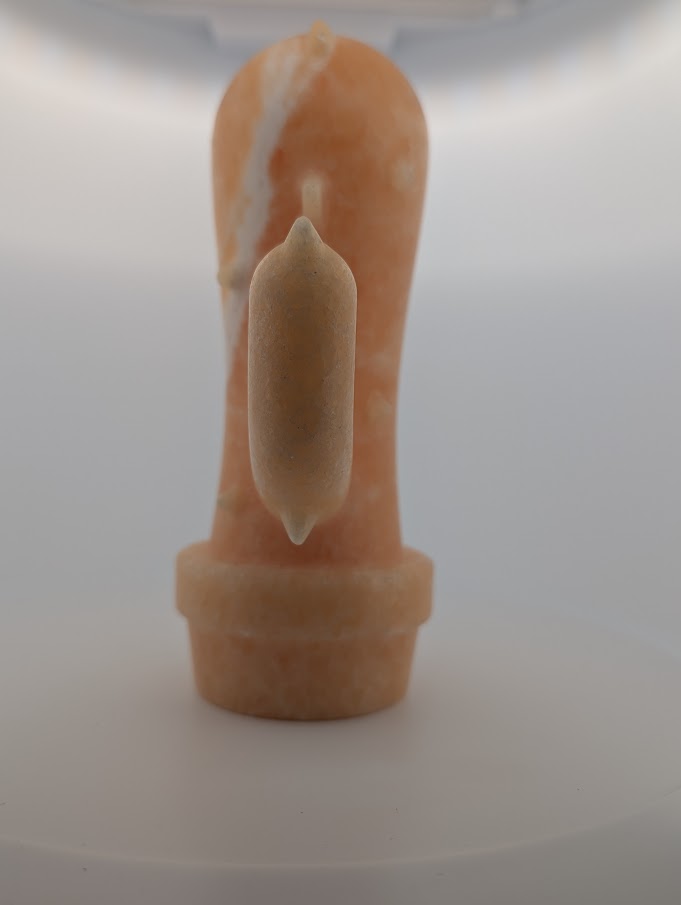 Side angle of Yellow Calcite cactus carving showing polished details