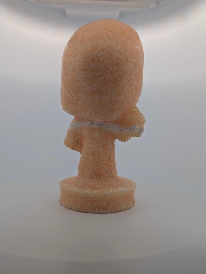 Back view of Yellow Calcite “The Scream” crystal carving