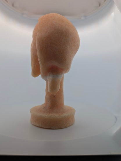 Side angle of Yellow Calcite “The Scream” crystal carving