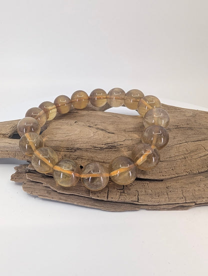 12 mm yellow fluorite bracelet with honey-gold translucent beads