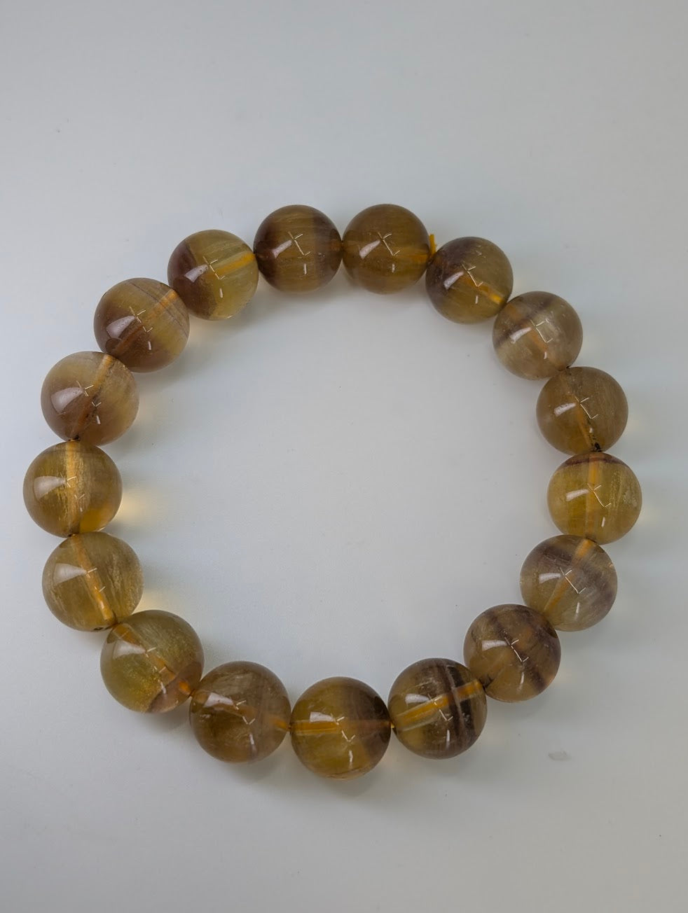 Natural yellow fluorite bracelet on stretch cord with uniform round beads
