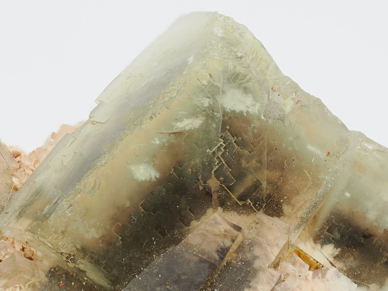 Sharp cubic corner of yellow fluorite crystal showing glassy luster and step-growth.
