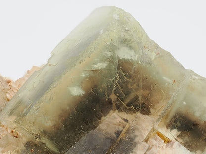 Sharp cubic corner of yellow fluorite crystal showing glassy luster and step-growth.