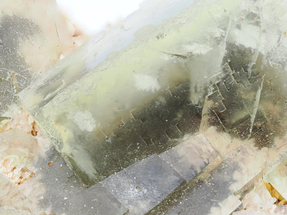 Macro detail of golden fluorite crystal showing internal phantom layers and zoning.