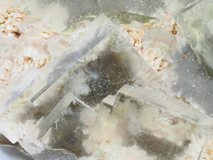 Close up of intergrown yellow fluorite cubes with stepped crystal faces.