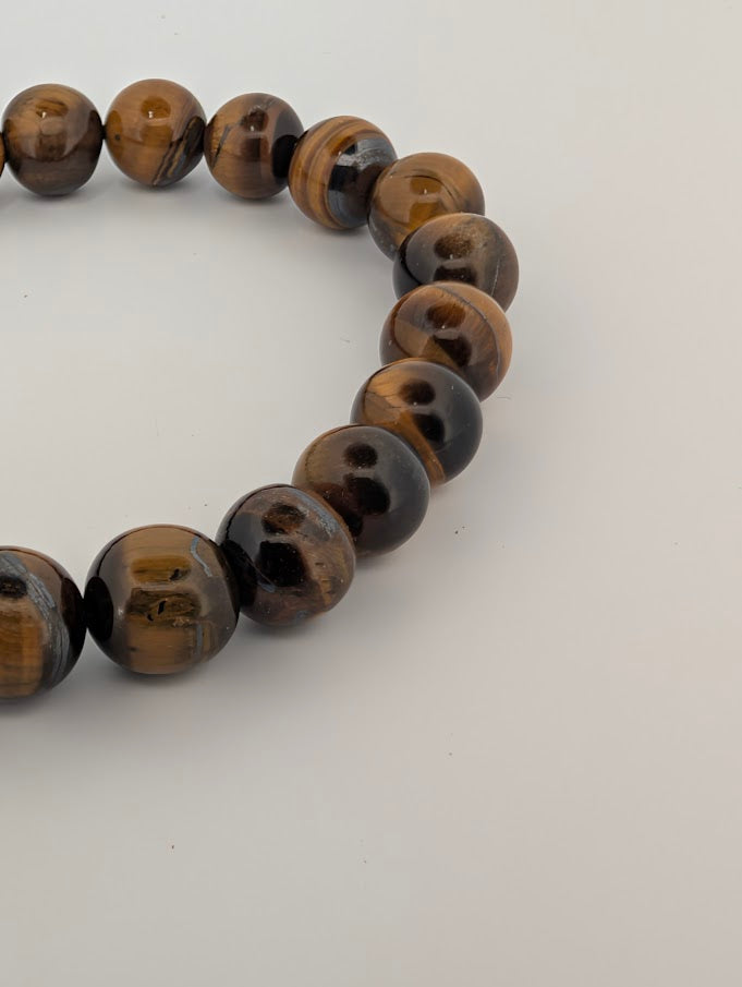 Side view of Yellow Tiger Eye bracelet highlighting chatoyant luster