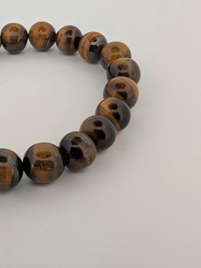 Side view of Yellow Tiger Eye bracelet highlighting chatoyant luster