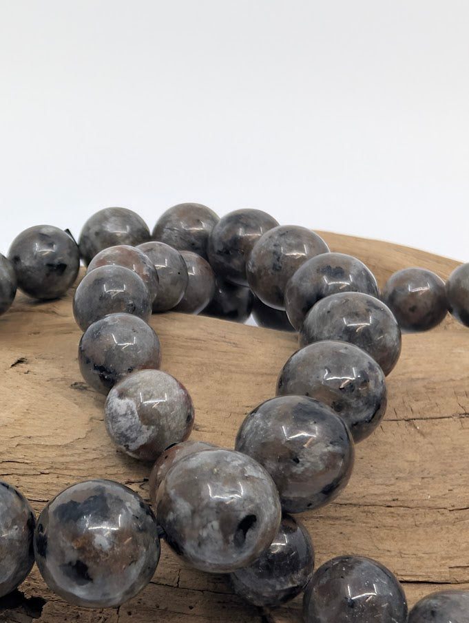 Close-up of polished 8MM and 6MM Yooperlite beads